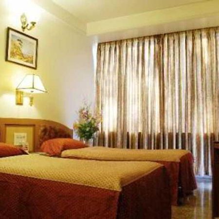 Hotel Mandakini Ambience Пуна Номер фото